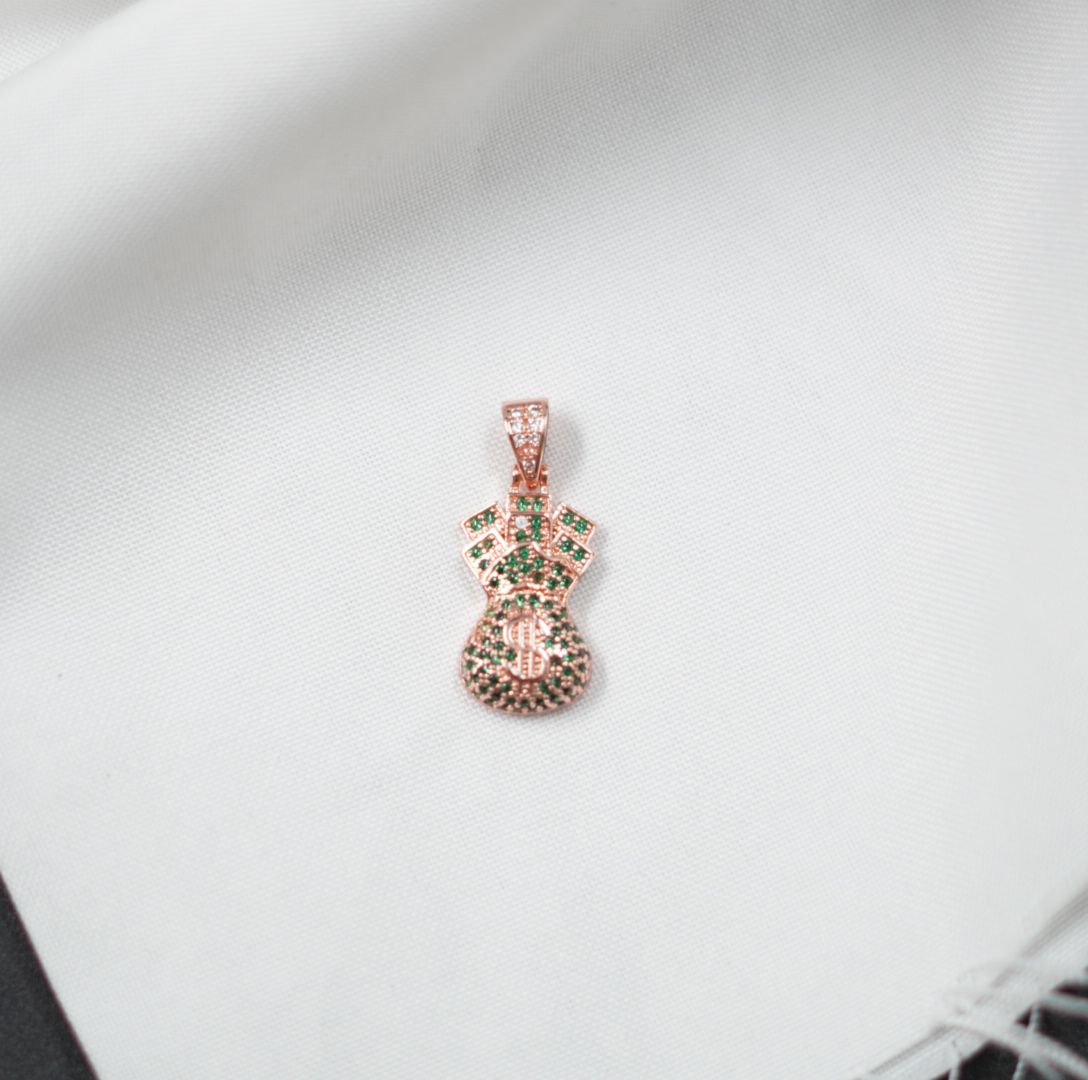 Miniatura 1 de DIJE BOLSA DINERO ROSADO PIEDRAS VERDES